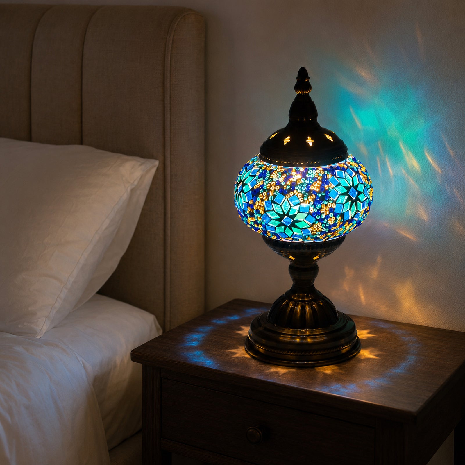 Azura Mosaic Lamp glowing beside a bed