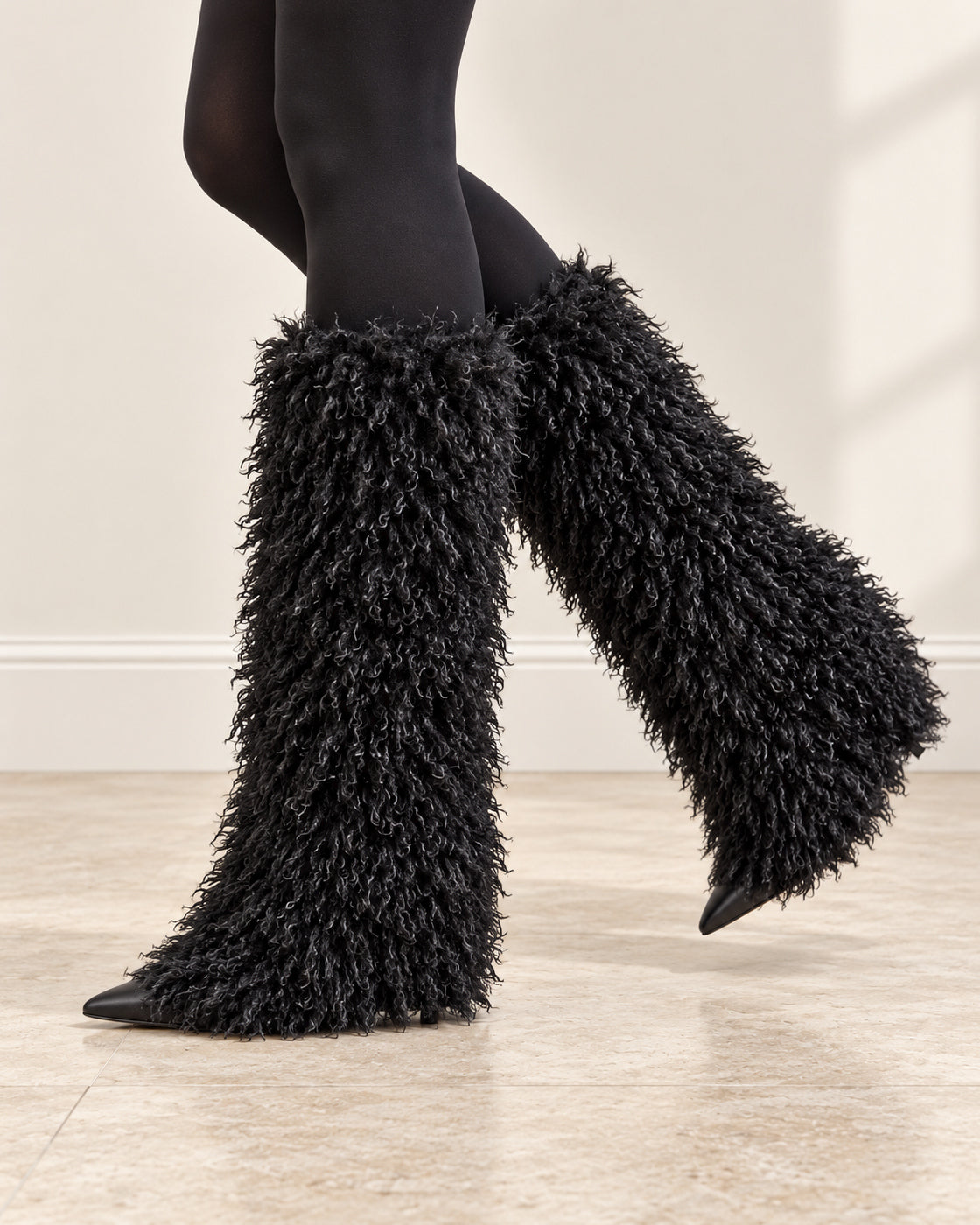 Borelle Shag Boots in Black — raised crossed leg