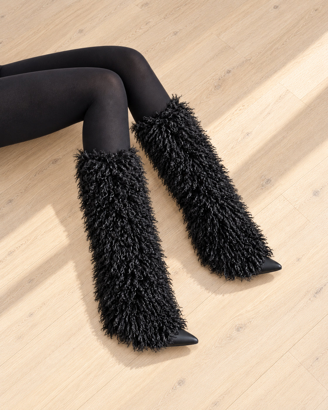 Borelle Shag Boots in Black — seated overhead