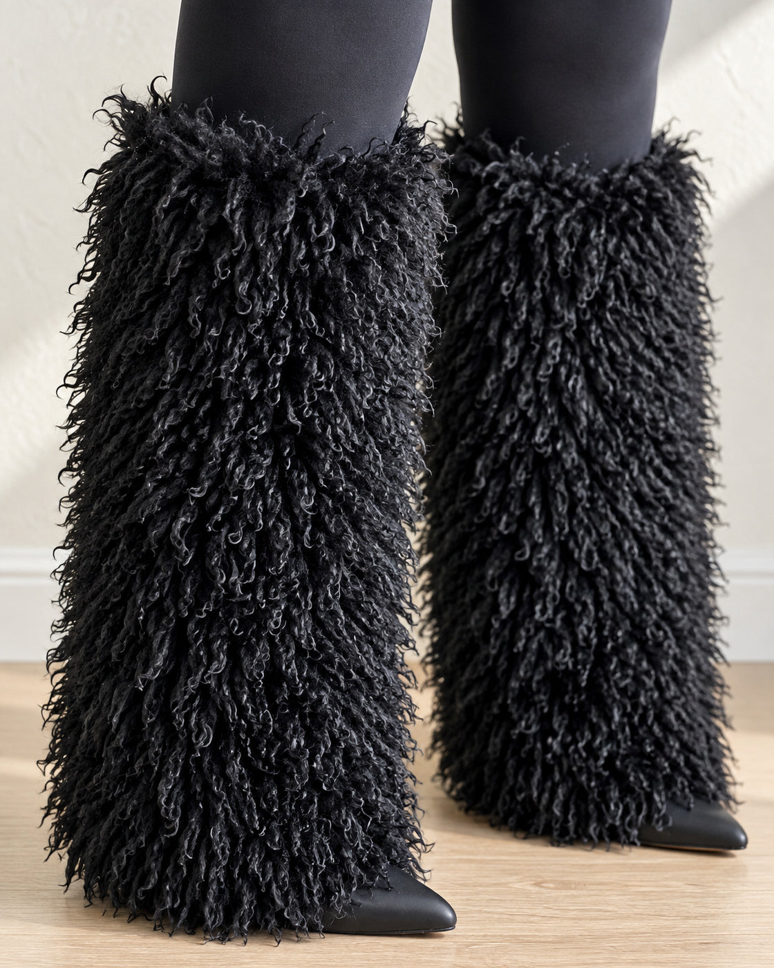 Borelle Shag Boots in Black — front detail showing the curled shaft and pointed toes