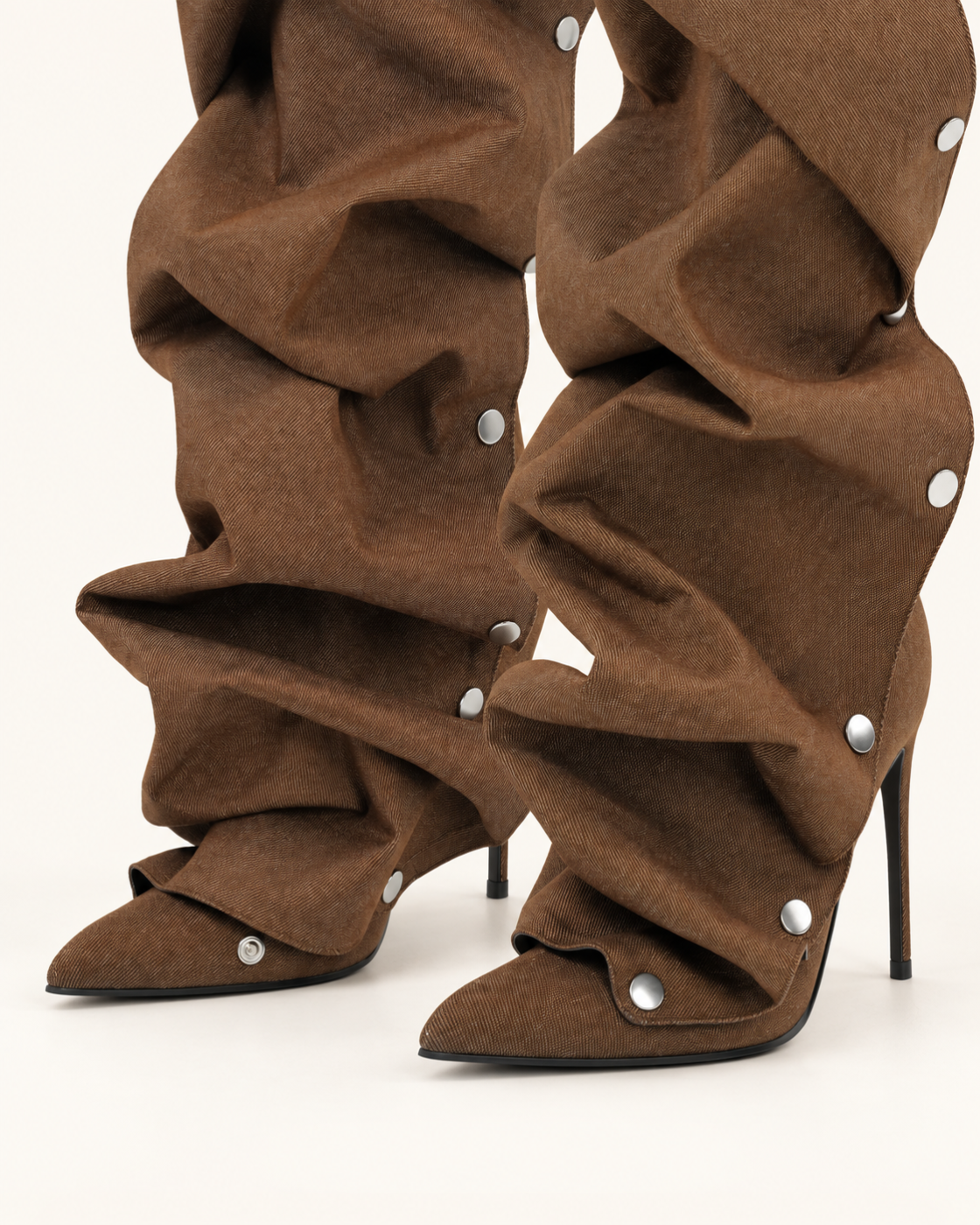Detail of pointed toes and snap-fastened outer gaiters in Brown