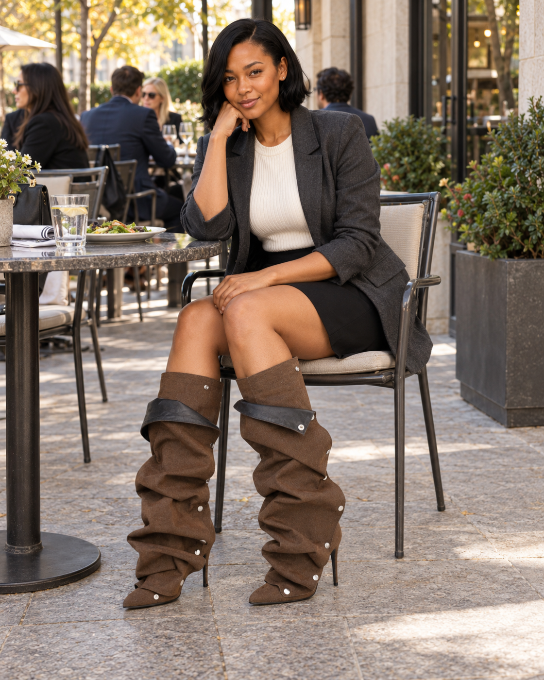 Seated model styling Brown Ismerie Gaiter Boots for an outdoor lunch