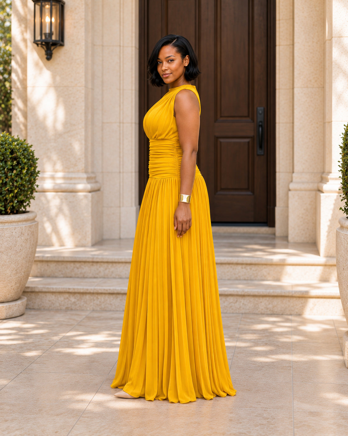Lisara Pleated Maxi Dress in Golden — Model 3, side view