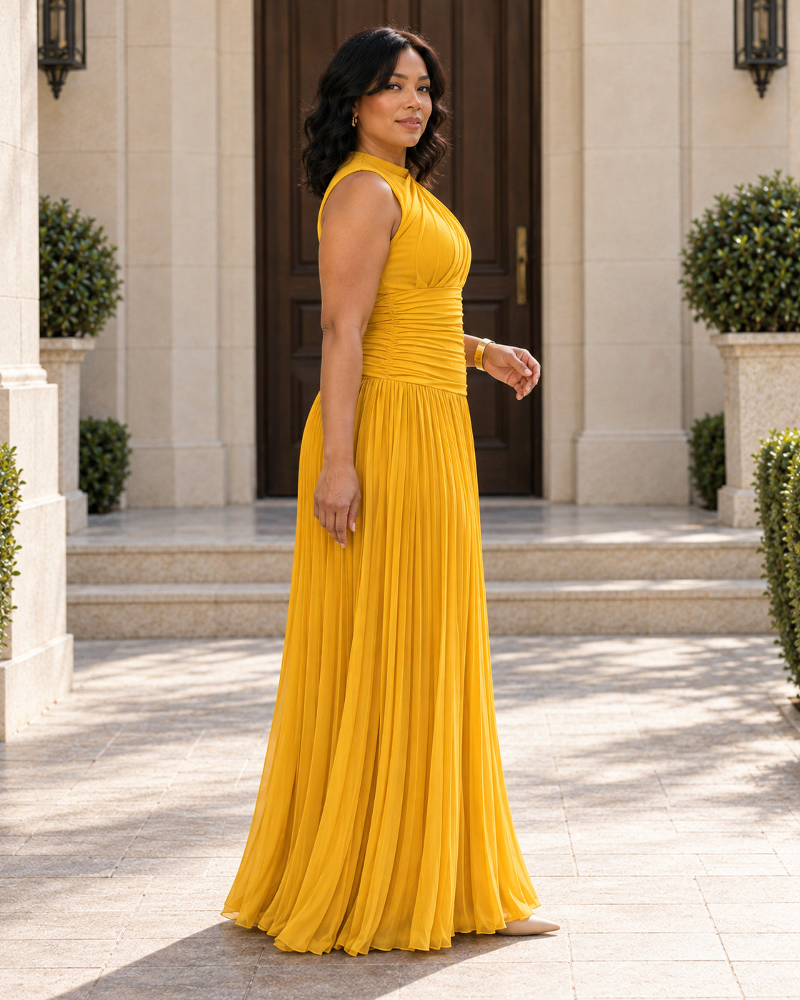 Lisara Pleated Maxi Dress in Golden — Model 10, side view