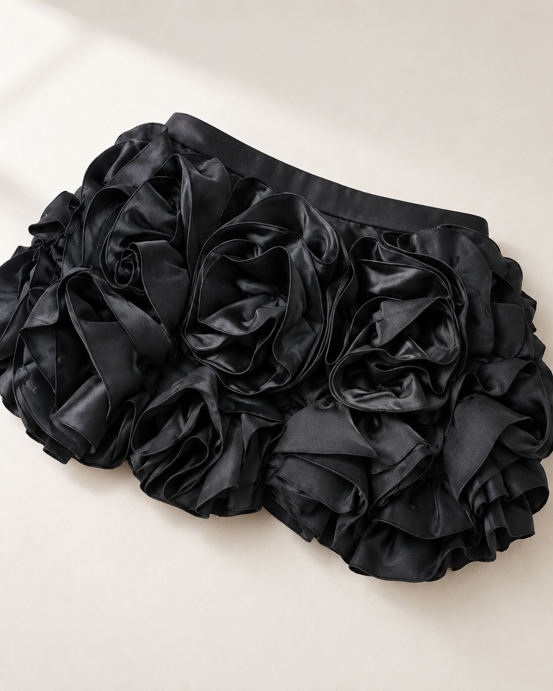 Ravelle Rosette Skirt Set in Black — dimensional rosette mini skirt close-up