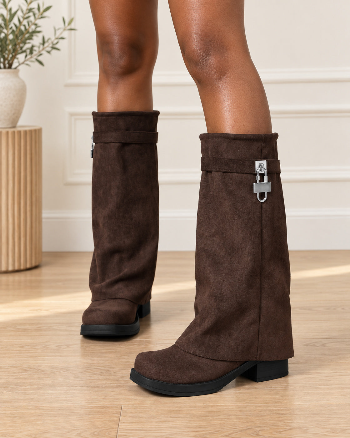 Chocolate Romilly slouch boots worn in a three-quarter front view
