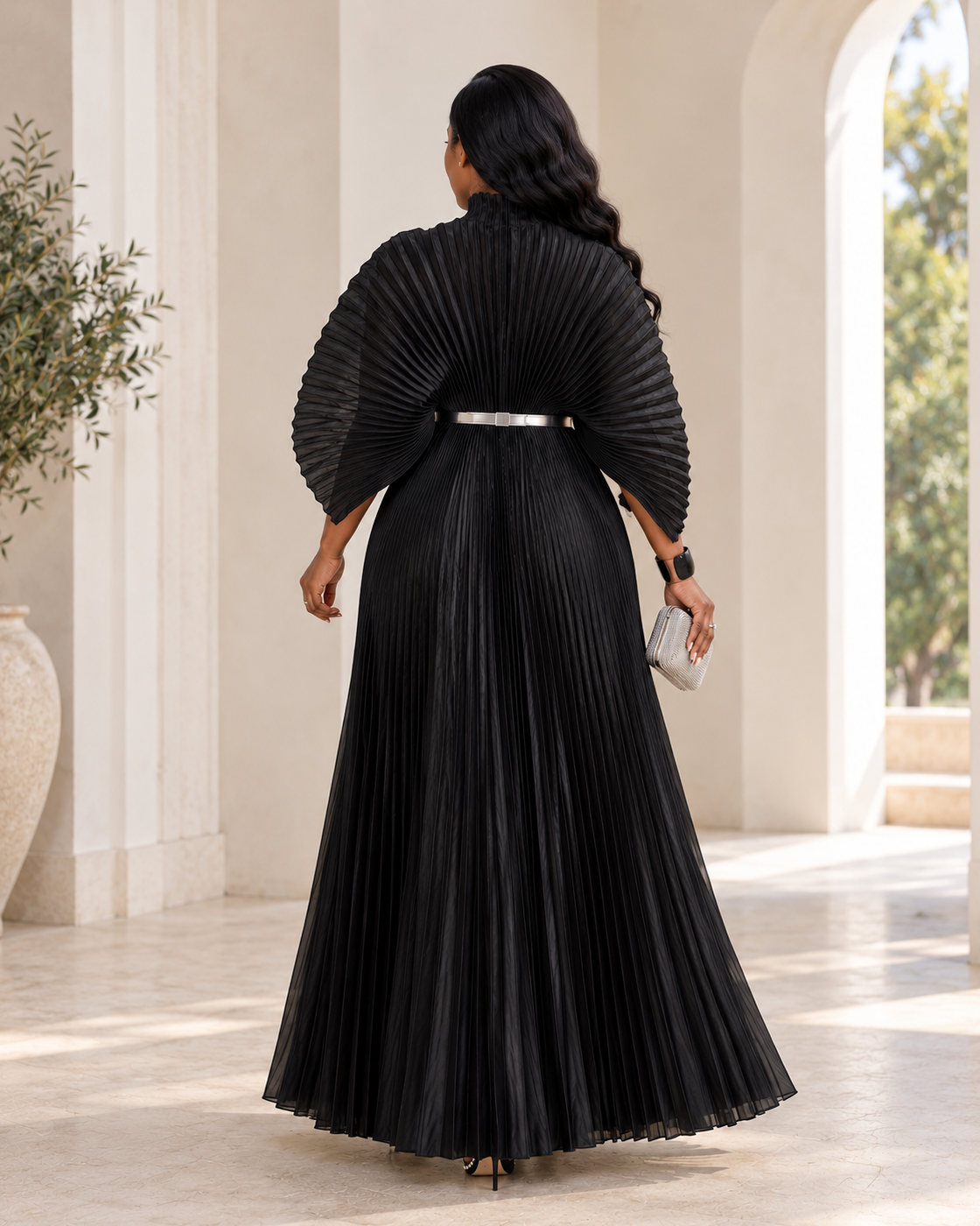 Serapha Pleated Maxi Dress in Black — back view; styling belt not included