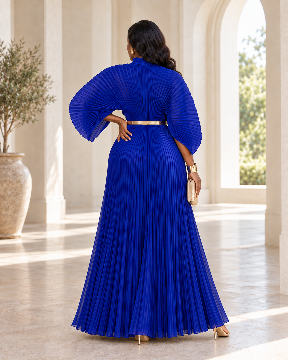 Serapha Pleated Maxi Dress in Blue — back view; styling belt not included