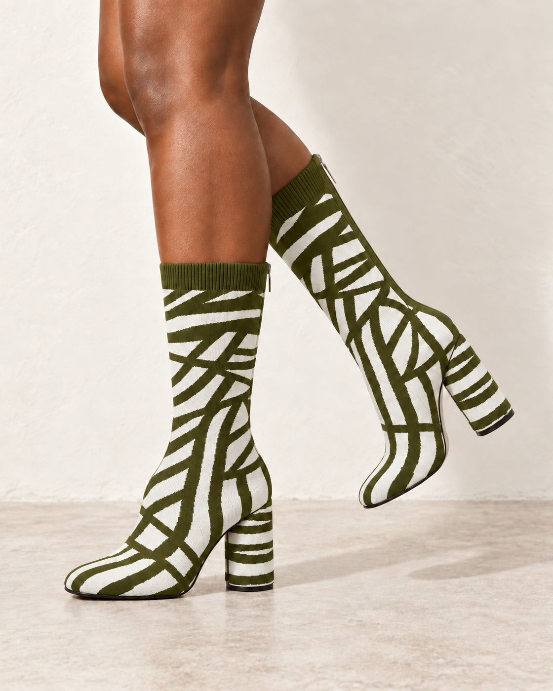 Viretta Knit Boots in Olive / Cream — raised leg side on foot
